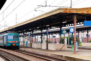 train on railway platform photo