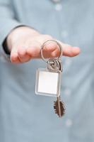 blank key ring in hand close up photo