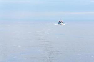 boat in sea at early morning photo