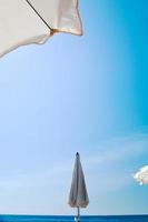 parasols, sea, blue sky photo