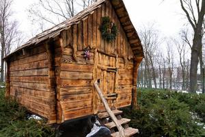 Moscow, Russia - January 2, 2021 an amusement park with wooden fairy-tale houses, a playground with sculptures of fairy-tale characters. photo