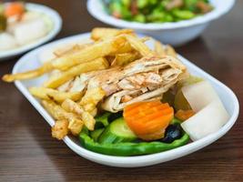 fast food Shawarma with chicken meat on plate photo