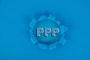 PPP LOAN FORGIVEN, text written on a blue background. photo