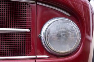 Old car headlight of a fire truck. Close-up. photo