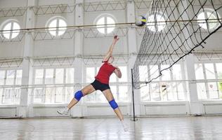 girls playing volleyball indoor game photo