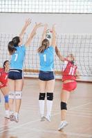 girls playing volleyball indoor game photo