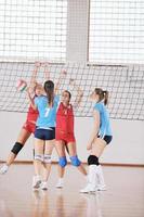 girls playing volleyball indoor game photo