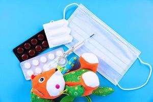 Suppository for anal or vaginal use and thermometer. Suppositories for the treatment of high fever in children. photo