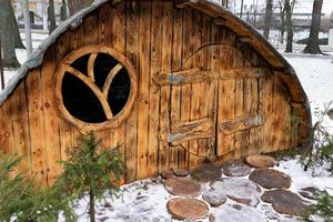 Moscow, Russia - January 2, 2021 an amusement park with wooden fairy-tale houses, a playground with sculptures of fairy-tale characters. photo