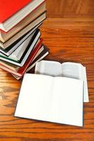 open books on wooden table photo