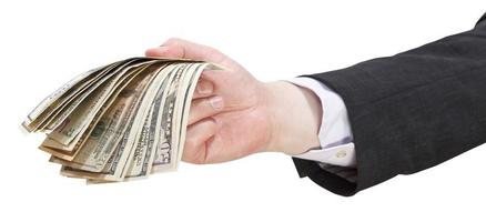 many dollar banknotes in businessman hand photo
