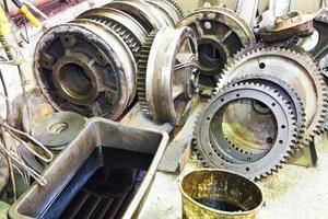 gears of disassembled motor in mechanical turnery photo