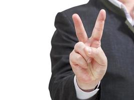 el hombre de negocios tiene el signo de la victoria - gesto de la mano foto