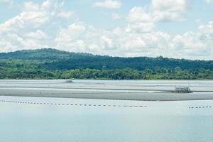 Floating solar farm or floating photovoltaics. Solar power. Landscape of solar panels floating on water in reservoir or lake. Solar technology. Alternative renewable energy. Sustainable resources. photo