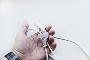 White power cord on a white background. Electric cord on a white background. photo