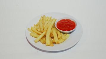 French fries and hot sauce on a plate photo