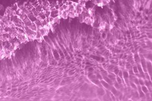 Defocus blurred transparent pink colored clear calm water surface texture  with splash, bubble. Shining pink water ripple background. Surface of water  in swimming pool. Pink bubble water shining. 13040673 Stock Photo at