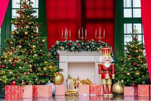Theatre stage with new year decorations. Fireplace, Nutcracker. giftboxes. Celebration christmas performance for children and adults during winter holidays photo