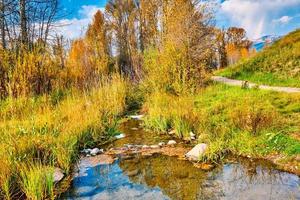 Small creek in Teton mountain range Autumn landscape photo