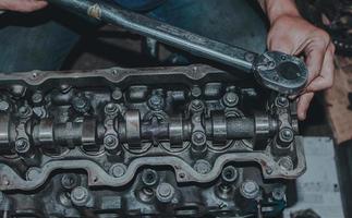 The mechanic is checking the engine. photo