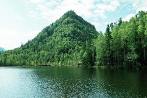 Beautiful landscape, mountains on the lake shore photo