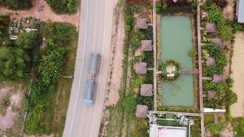 Beautiful aerial view to road with moutains and forest captured from above, photo