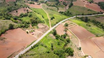 Beautiful aerial view to road with moutains and forest captured from above, photo