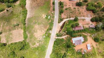 Beautiful aerial view to road with moutains and forest captured from above, photo