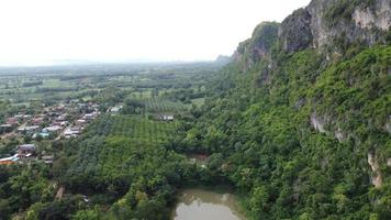 Beautiful aerial view to road with moutains and forest captured from above photo