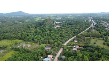 Beautiful aerial view to road with moutains and forest captured from above photo