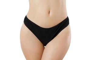 Blank Template Black Women Panties Front view mock up. Woman flat belly and good nutrition. Bikini anderwear with shave line and perfect skin. Cropped image. Body care and healthcare. Spa, copy space photo