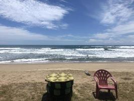 beach background with chairs and table photo