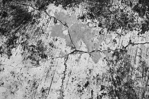 The pattern of the outdoor cement floor with cracks and stains on the surface of cement floor, soft and selective focus. photo