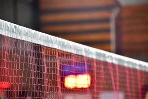 Badminton net in indoor badminton court, Soft and selective focus on net. photo