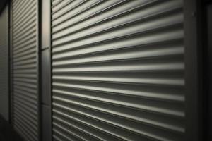 Closed shop. Steel blinds. Blinds on office windows. photo