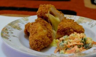 This is home cooking, Chicken Cordon bleu or schnitzel cordon bleu is a dish of chicken meat wrapped in cheese, then breaded and fried. photo