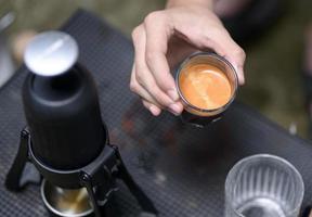 Beautiful crema coffee in a glass. photo