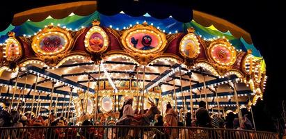 Osaka, Japan on April 9, 2019. Happy people ride the merry-go-round at Universal Studio Japan photo