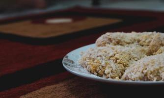 Chicken coated with breadcrumbs is ready to be fried,. photo