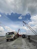 Jakarta, Indonesia, 2022. This is a process of casting concrete using a concrete pump to reach casting locations that are far away. photo