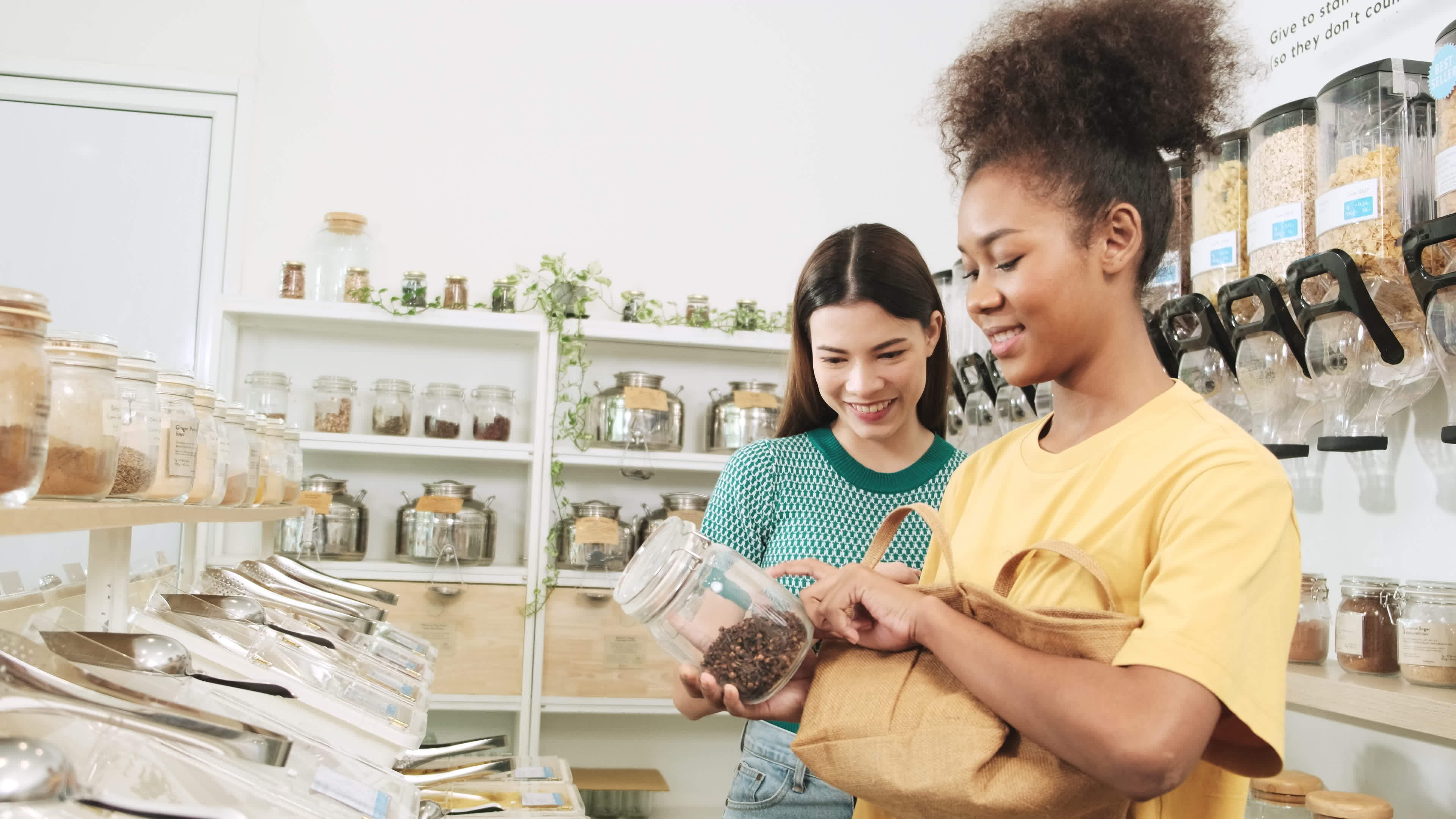 Two happy young female customers are choosing and shopping for organic  products in refill store with reusable bags, zero-waste grocery, and  plastic-free, environment-friendly, sustainable lifestyles. 12684478 Stock  Photo at Vecteezy