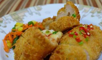 This is home cooking, Chicken Cordon bleu or schnitzel cordon bleu is a dish of chicken meat wrapped in cheese, then breaded and fried. photo