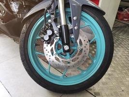 Close-up of motorcycle brakes and front wheel photo