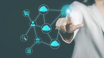 cyber security concept woman's hand using a smartphone to the system through the fingerprint scanner Store data into online Cloud Data storag for security. photo