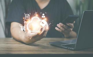 he concept of using technology to connect data to the world, business man use smartphones. online transaction on the internet Big data is used marketing payment Search information photo
