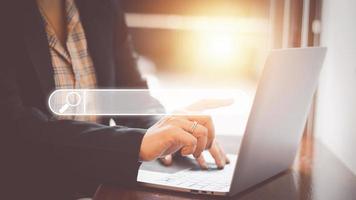 The concept of using technology to search engine optimizationfor information business woman using laptop to find online shopping information and other information for use in marketing photo