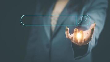 The concept of using technology to search engine optimizationfor information business woman using laptop to find online shopping information and other information for use in marketing photo