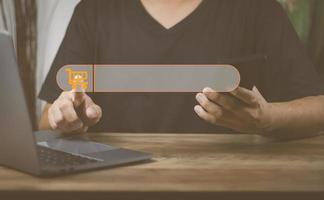 The concept of using technology to search for information, a man's hand is using a smartphone to search for information on social media via the Internet online. photo