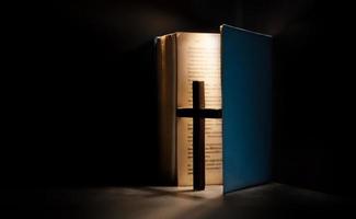 Spirituality, Religion and Hope Concept. Holy Bible and Cross on Desk. Symbol of Humility, Supplication,Believe and Faith for Christian People photo