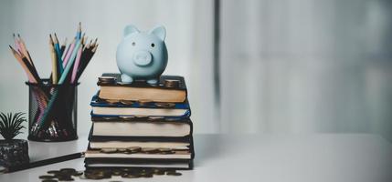 close-up education object with stack money coin-cash dollar and glass jar on background. Concept to saving money income for study, Calculating student finance costs and investment budget loan photo